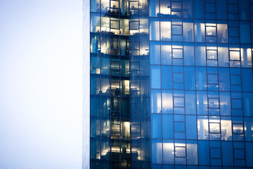 Highrise view with office windows at evening