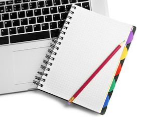 Empty  notebook on laptop keyboard, on light background