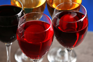 Glasses with wines of different colors on a table