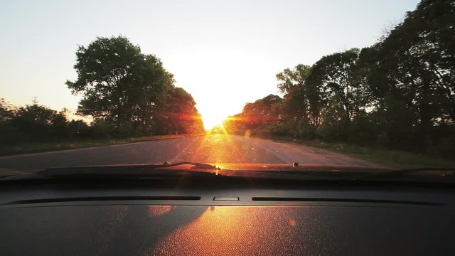 Vehicle point-of-view driving on road. Look through windscreen