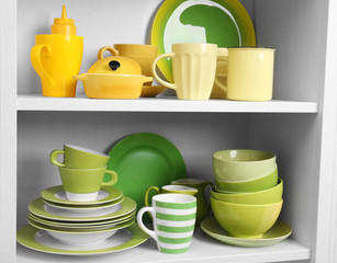 Tableware on shelves in the kitchen cupboard