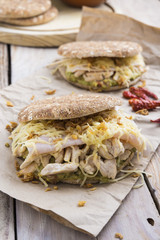 Sandwich with chickend and guacamole, cheese.