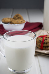 Very sweet retro bottle of milk with cookie on old table