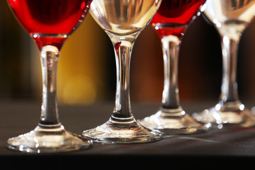 Glasses of red and white wine closeup
