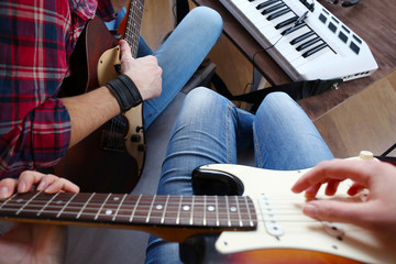 Man with guitar and synthesizer closeup © Africa Studio