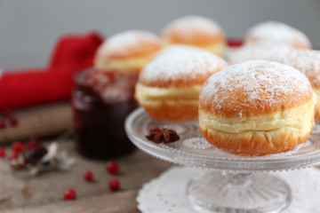 Fresh homemade donuts with powdered sugar, close up