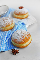 Fresh homemade donuts with powdered sugar, close up
