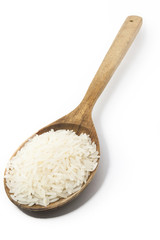 Fototapeta na wymiar rice and a wooden spoon on a white background.