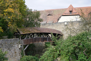 Fototapeta na wymiar Old wooden bridge in Rothenburg