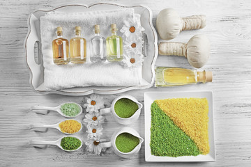 Spa ingredients on a white table, top view