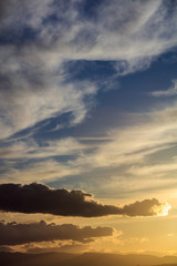 Majestic vivid sunset  over dark mountains