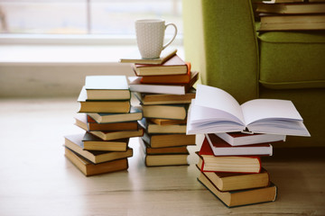 Pile of books on floor at home