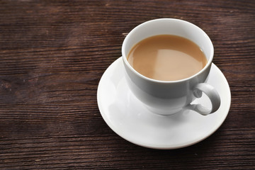 Milk tea on wooden background.