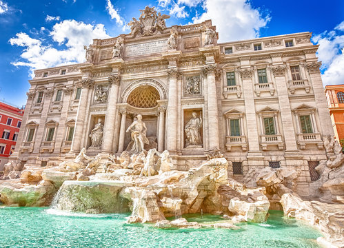 Fototapeta Spectacular Trevi Fountain, designed by Nicola Salvi Baroque era, in a sunny day, one of the most famous fountains in the world, capital of Rome, Lazio, Italy.