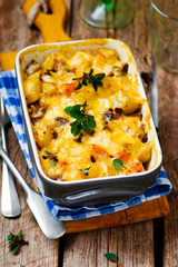 Baked pudding with pumpkin and mushrooms