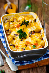Baked pudding with pumpkin and mushrooms