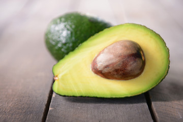 Fresh avocado on wooden background