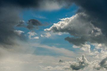 Storm clouds on blue sky