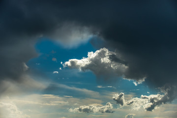 Naklejka na ściany i meble Blue sky with storm clouds