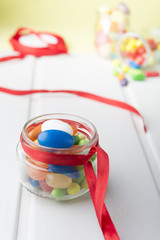 Multicolor candies in glass jars