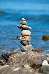Stone tower on a pebble beach