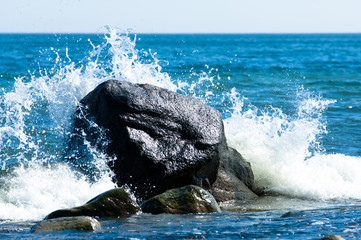 Baltic coastline with big rocks and crashing waves