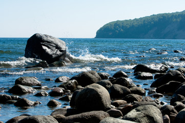 Baltic coastline with big rocks and brakeing waves