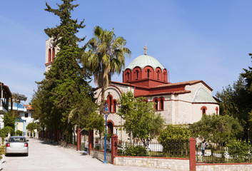 Church of the Assumption of the Blessed Virgin in Pefkohori. Greece. - obrazy, fototapety, plakaty