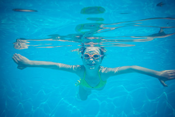 Fototapeta na wymiar Underwater portrait of child