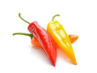 colored peppers over white background