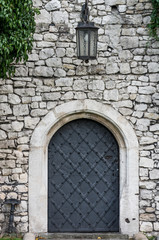 Old castle door with lantern
