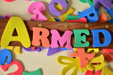 slowo armed na kolorowym tle © czany