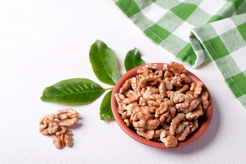 walnut kernels in a bowl on a table