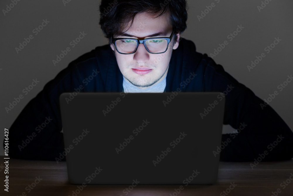 Poster guy with glasses hacking computer