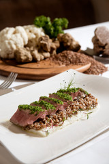 baked steak with mashed cauliflower and buckwheat