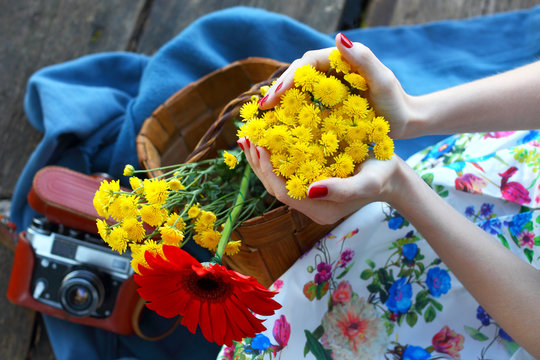 Relaxation, rest, romanticism.The beautiful woman with a basket of flowers. 