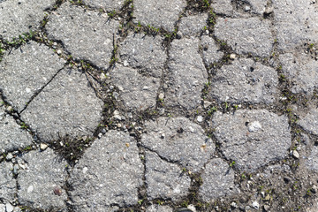Texture of the old road with cracks