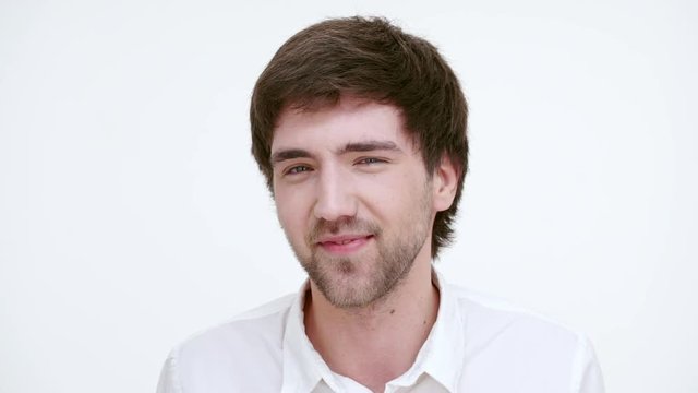 Handsome man doesn't believe you. Close up. Slow motion