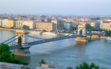 Fototapeta na wymiar Chain Bridge over the Danube River, Budapest. Tilt-shift effect applied