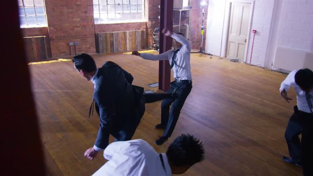  Handsome businessman or special agent character outnumbered in a fight 