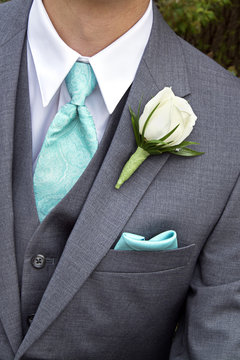 male tie and rose boutonniere for wedding jacket