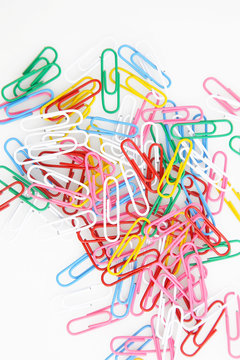 Top view colorful paper clips on white background
