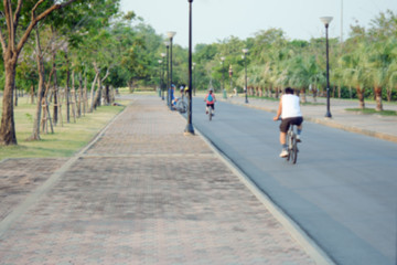 Fototapeta premium People relax in park and garden with blurred view