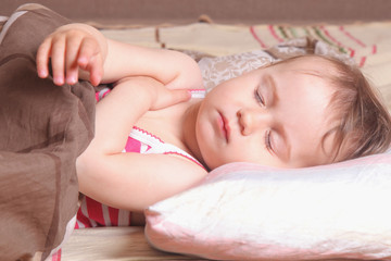 Fototapeta na wymiar beautiful little baby girl sleeping (childhood, security, family