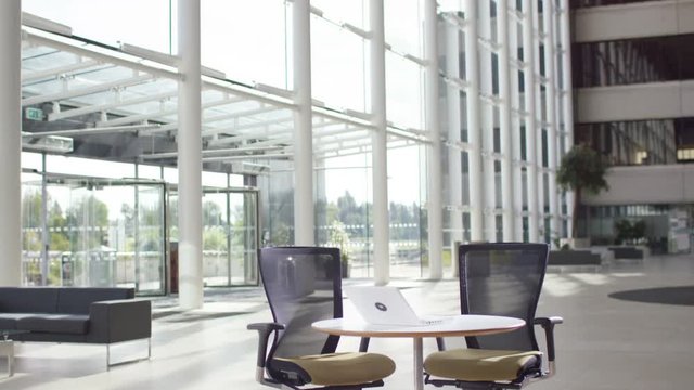 Empty interior of modern office building with focus on work space