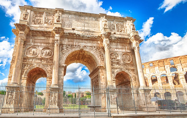 Fototapeta na wymiar The spectacular Arch of Constantine, located between the Colosseum and the Arch of Titus, built to celebrate the triumph of the emperor Constantine in a sunny day. Rome, Lazio, Italy.