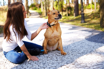 Female with brown dog.