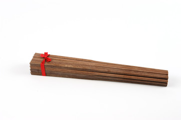 pack of wooden chopsticks isolated on white background
