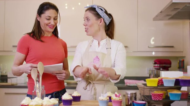  TV presenters on a cookery channel making cupcakes & talking to camera