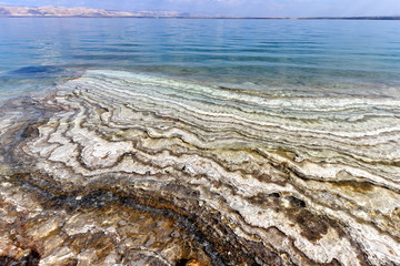 The Dead Sea also called the Salt Sea, is a salt lake bordered by Jordan to the east and Israel